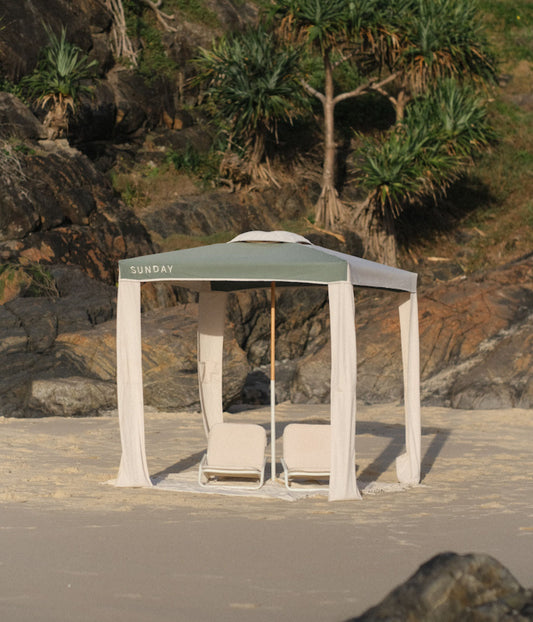 Tallow Splice beach cabana set up on sand with the canopy providing family shade