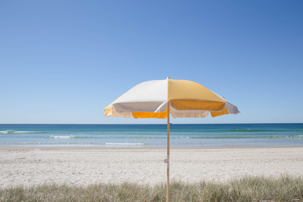 Golden Splice Beach Umbrella overlooking the ocean